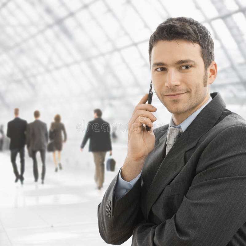 Businessman talking on mobile stock image