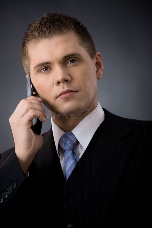 Businessman talking on mobile royalty free stock photography