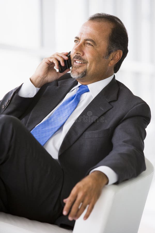 Businessman talking on mobile phone royalty free stock image