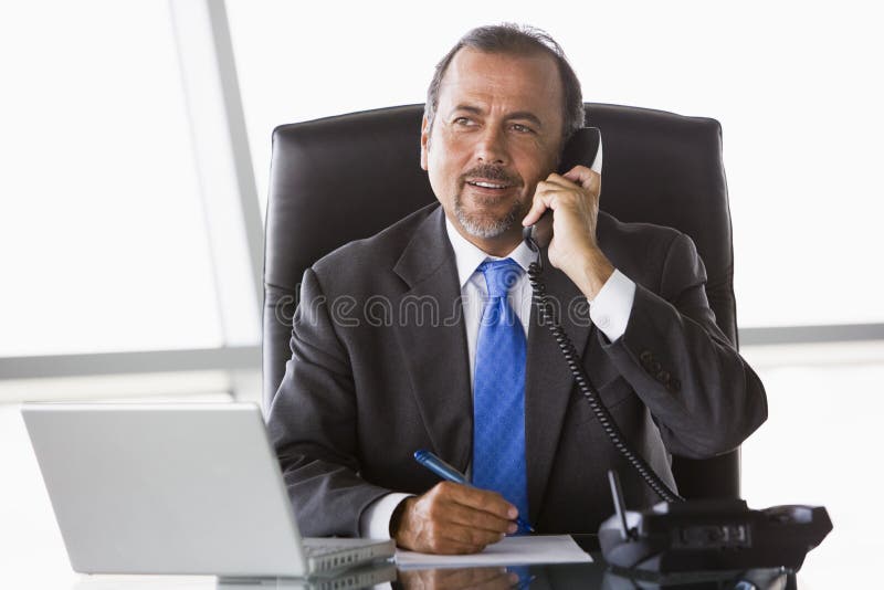 Businessman talking on phone stock image