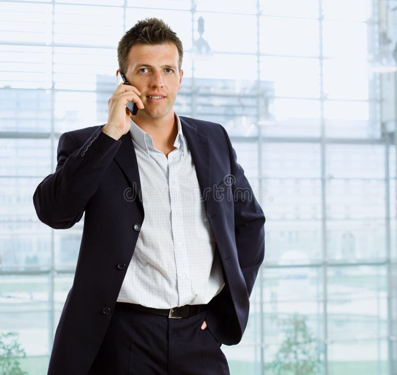 Businessman talking on phone royalty free stock image