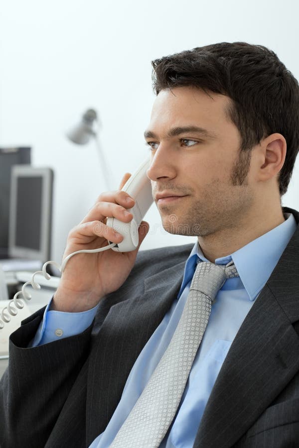 Four Businesspeople in a Boardroom Writing Stock Photo - Image of ...