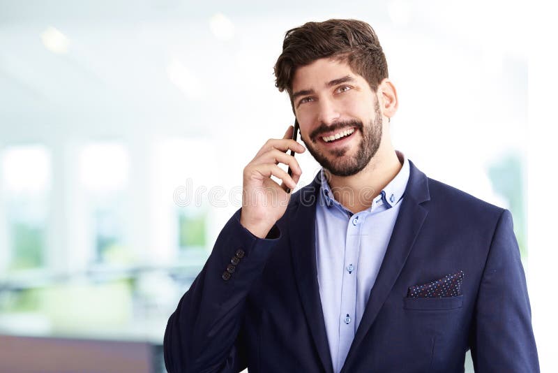Businessman talking with somebody on his mobile phone royalty free stock images
