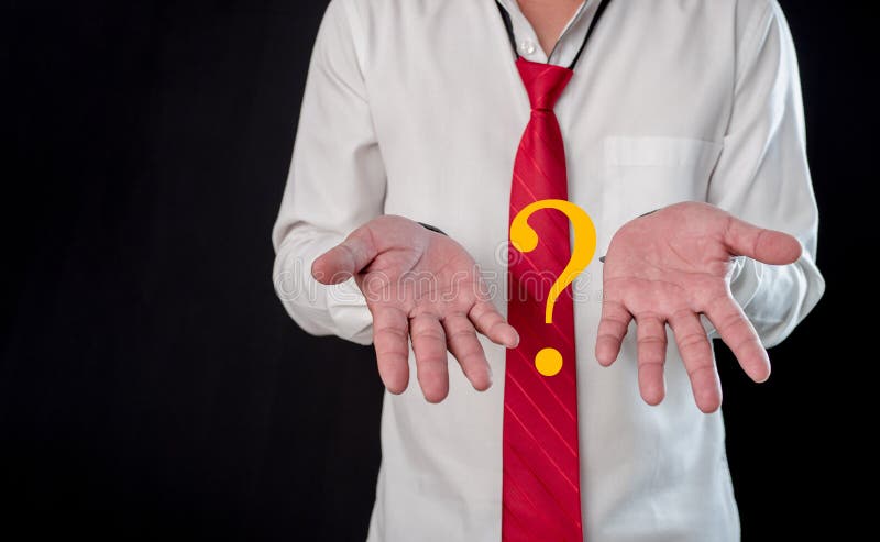 Businessman thinking and questioning with two hands with question mark. conceptual decision making. Business selection concept. stock photography