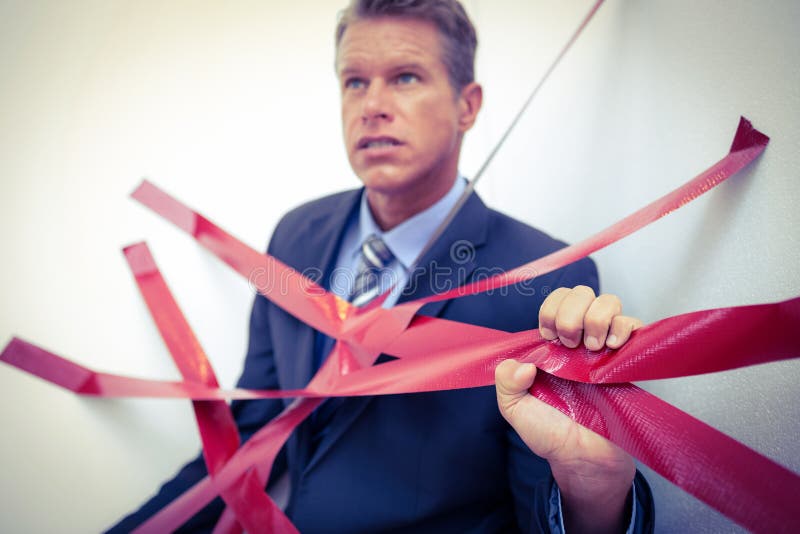 Businessman Trapped by Red Tape Stock Photo Image of elegant