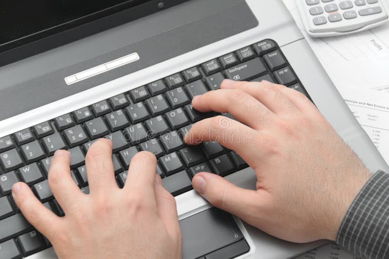 Businessman typing on notebook (laptop)