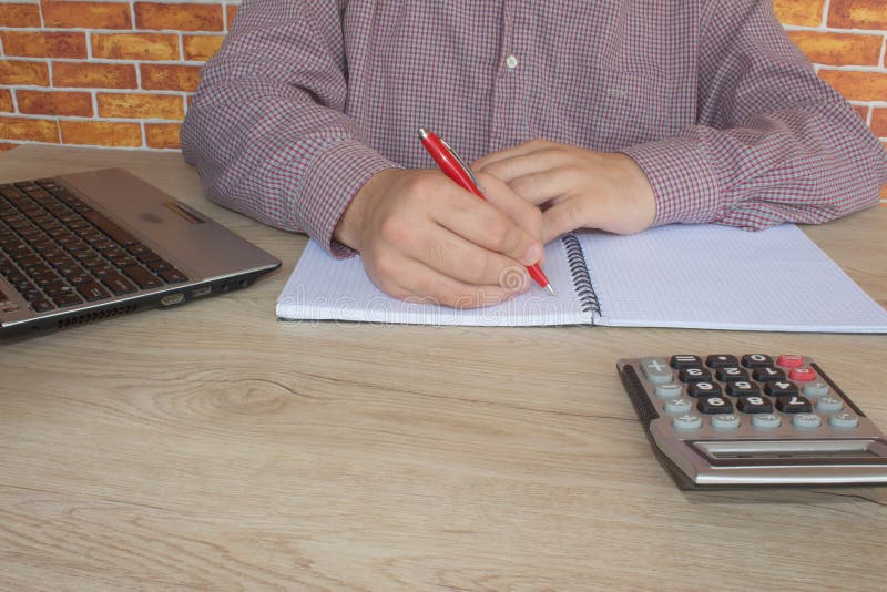 Businessman using a calculator to calculate the numbers. Accounting , Accountancy, Calculation Concept royalty free stock photo