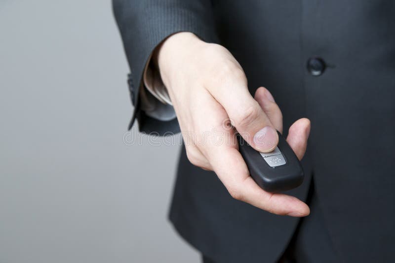Businessman using car key stock photo