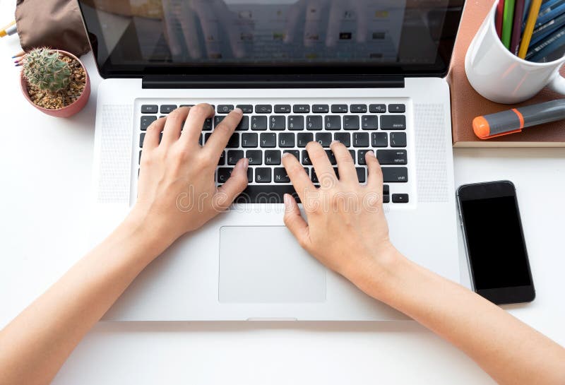 Businessman using computer with hands typing on a keyboard royalty free stock images