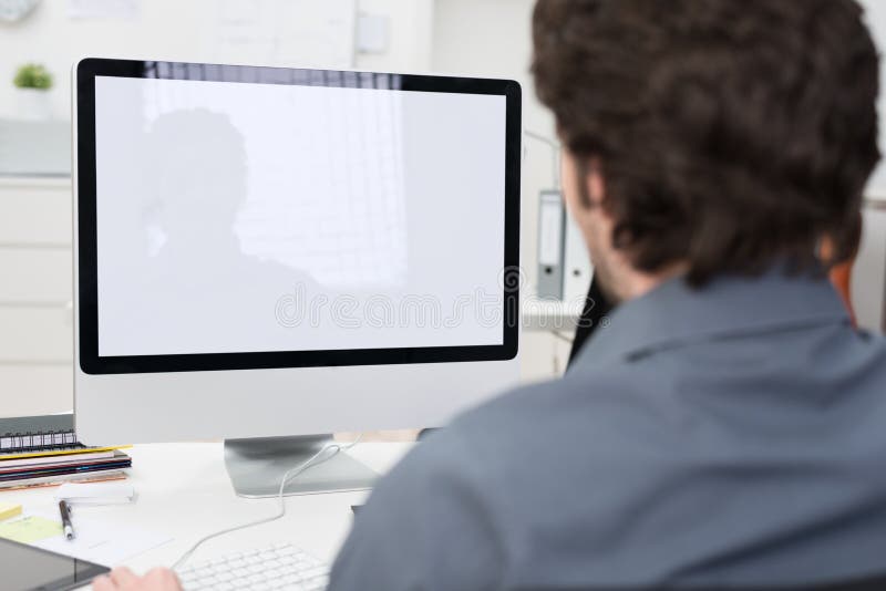 Businessman using a desktop computer royalty free stock photography