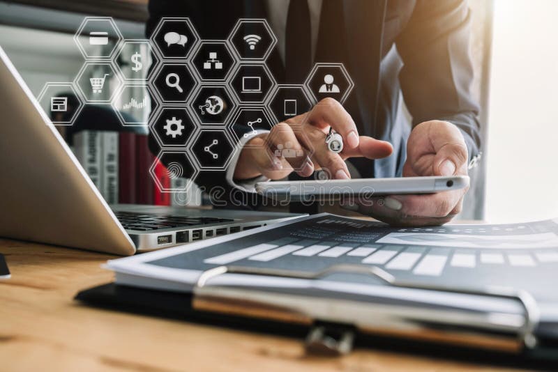 Businessman using digital tablet analyzes business data, busy working on laptop computer. stock images Businessman using digital tablet analyzes business data, busy working on laptop computer. stock images