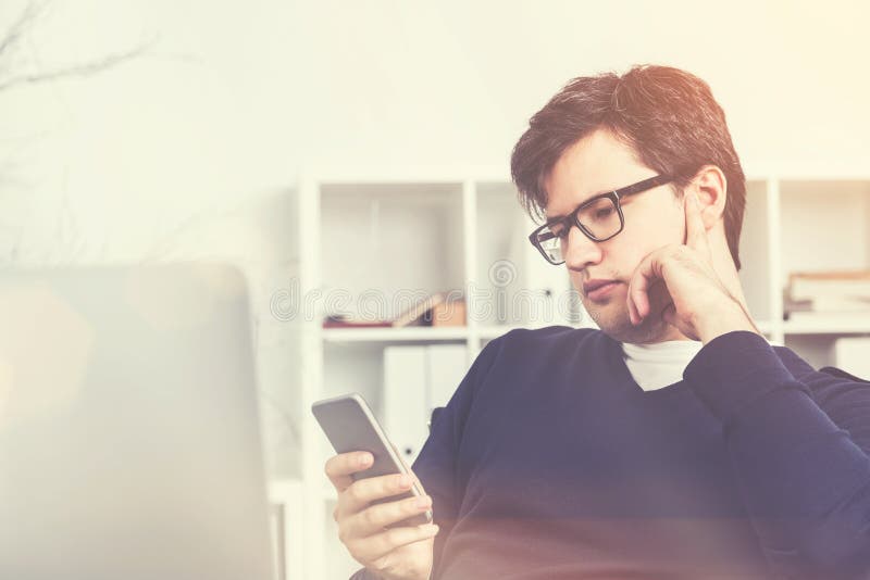 Businessman using his smartphone, toned stock photo Businessman using his smartphone, toned stock photo