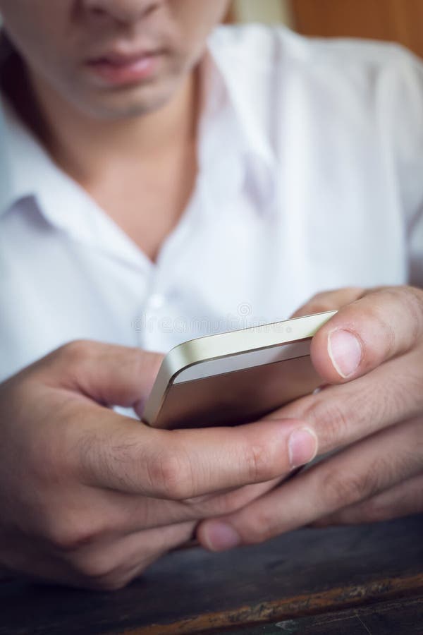 Businessman using a mobile phone with texting message royalty free stock images