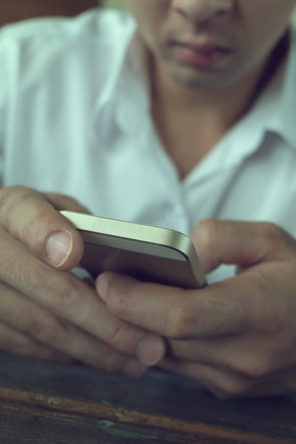 Businessman using a mobile phone with texting message royalty free stock image