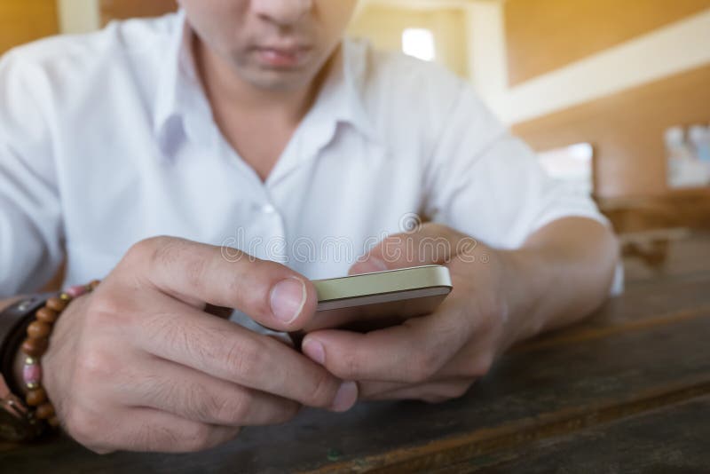 Businessman using a mobile phone with texting message royalty free stock photo