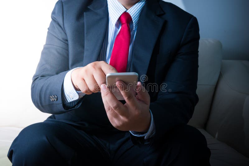 Businessman using mobile smartphone royalty free stock image