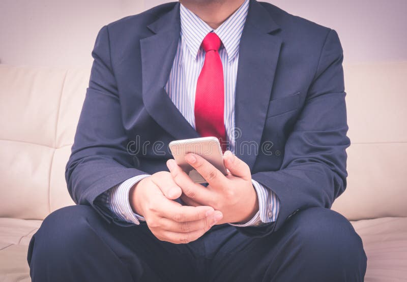Businessman using mobile smartphone royalty free stock photography