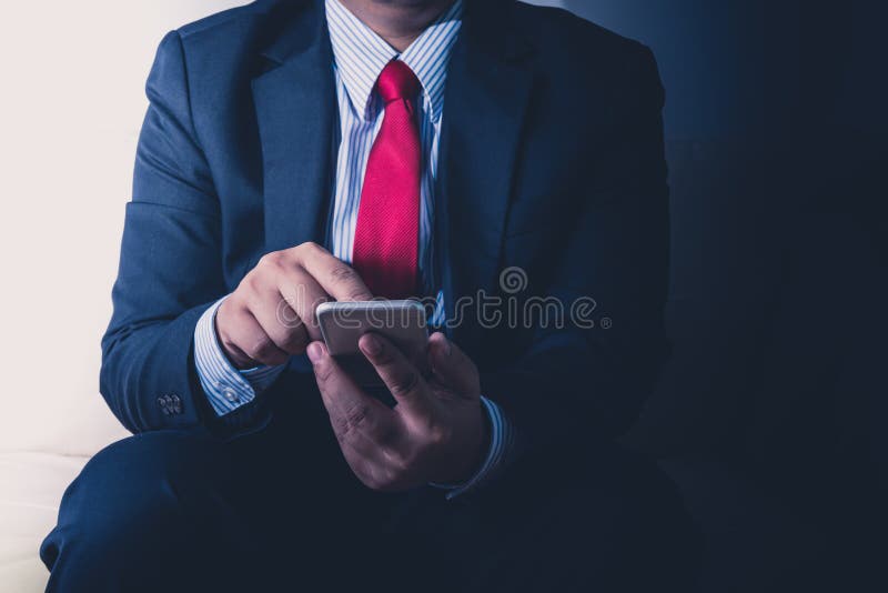 Businessman using mobile smartphone royalty free stock image