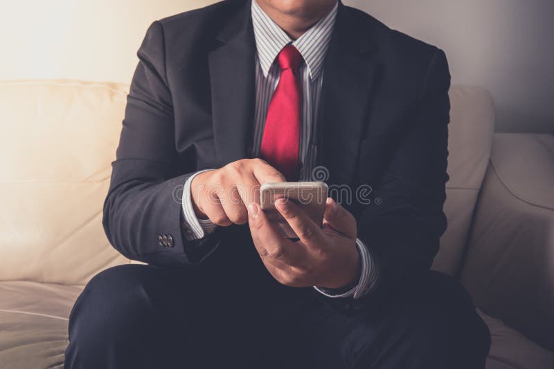 Businessman using mobile smartphone stock photography