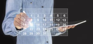 Businessman Using Pen To Set Meeting Agenda On Calendar As Appointment Businessman Using Pen To Set Meeting Agenda On Calendar As Appointment