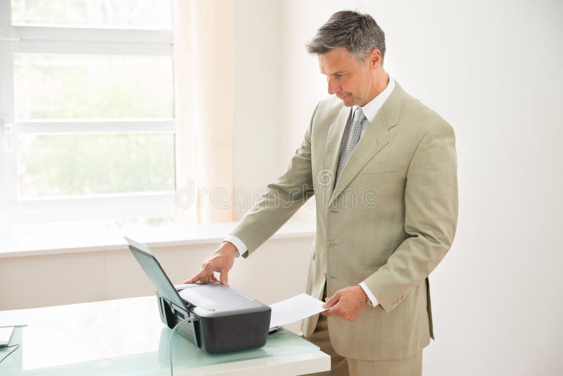 Businessman Using Photocopy Machine Stock Photo Image of corporate
