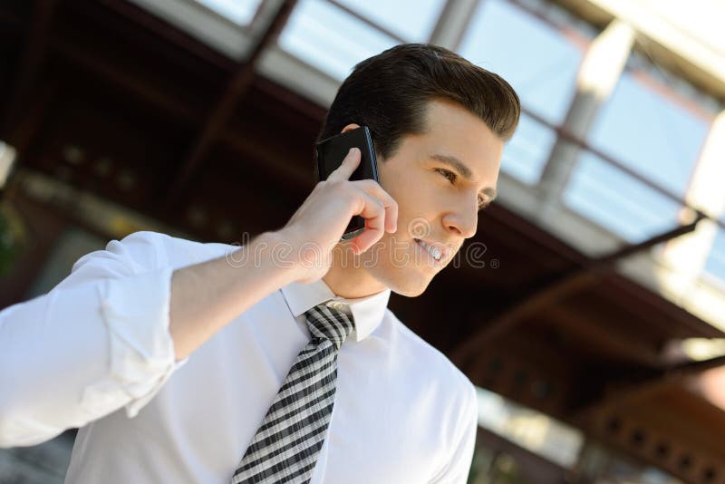 Businessman using a smart phone in an office building