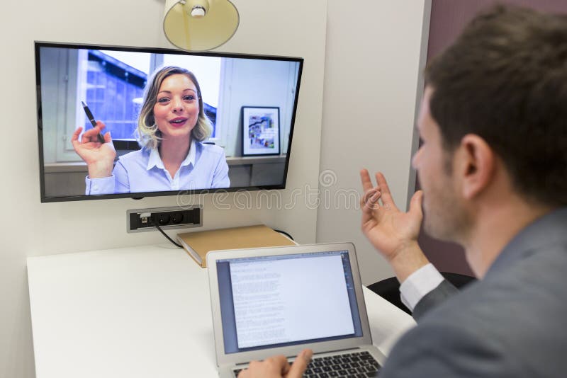 Businessman arguing with a businesswoman in visioconfÃ©rence. Businessman arguing with a businesswoman in visioconfÃ©rence