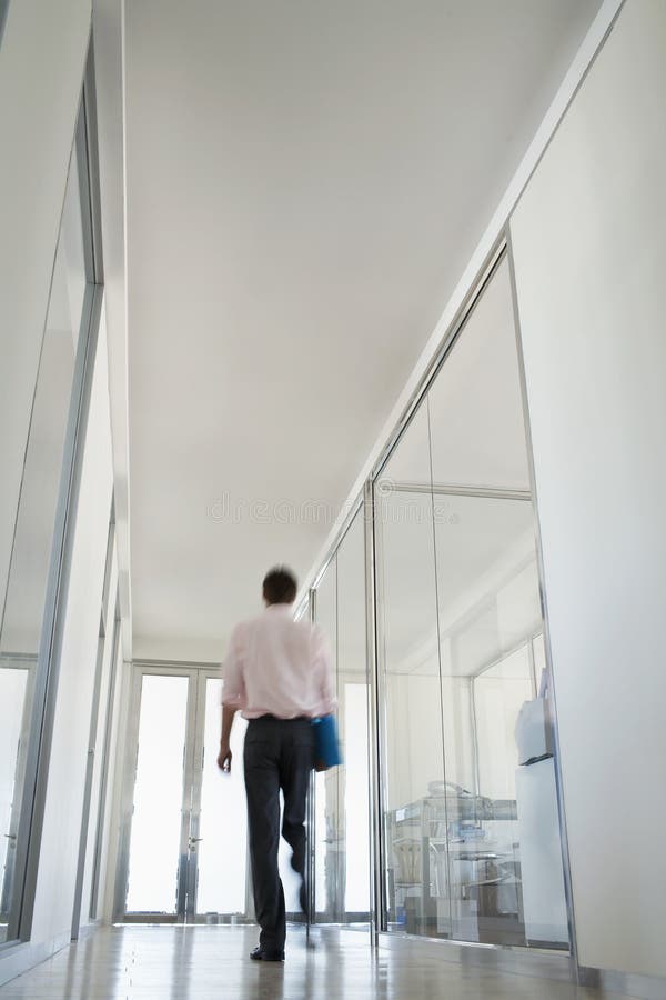 Businessman Walking In Corridor