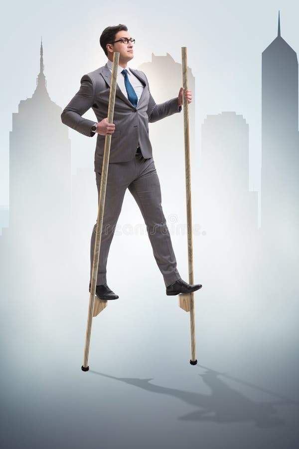 The Businessman Walking on Stilts Standing Out from the Crowd Stock