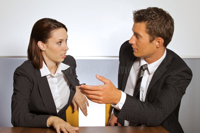 Businessman and Woman in Conversation at Office Stock Image - Image of ...