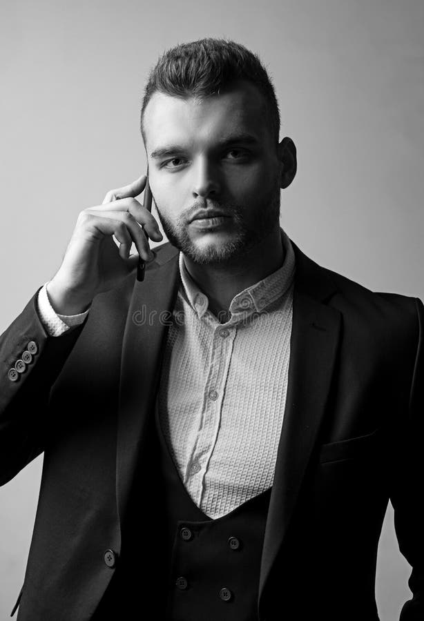 Businessman in work with phone mobil. Classic suits. Man suit fashion. Meeting phone. royalty free stock image Businessman in work with phone mobil. Classic suits. Man suit fashion. Meeting phone. royalty free stock image