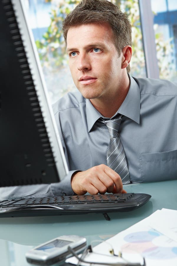 Businessman working on computer royalty free stock image