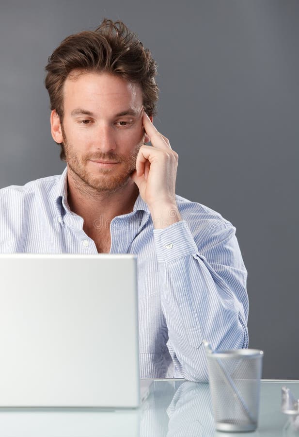 Businessman working with computer stock photography