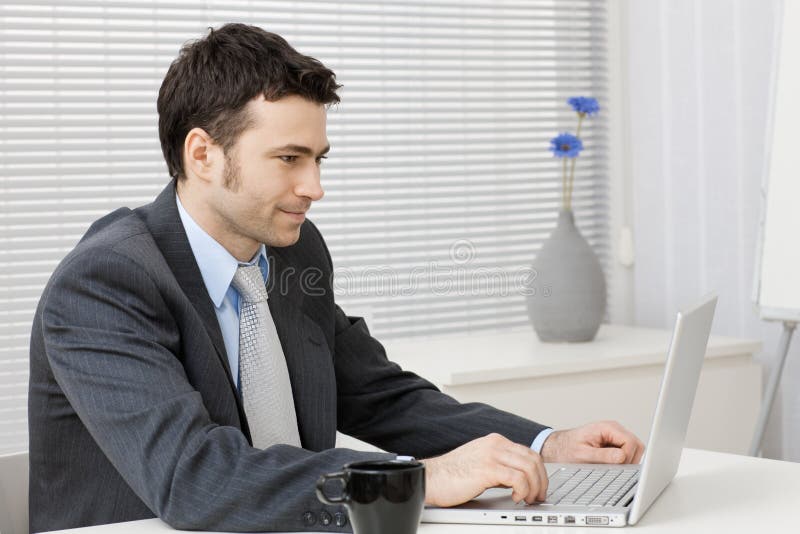Businessman working on computer royalty free stock image