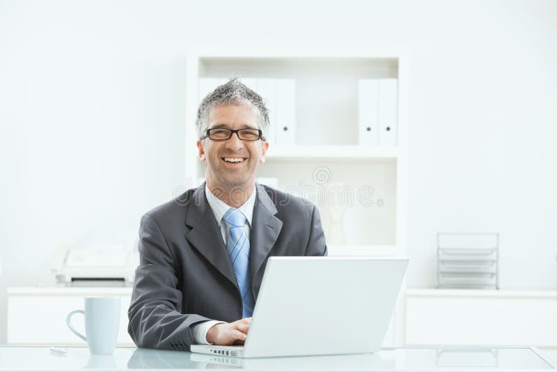 Businessman working at desk royalty free stock image