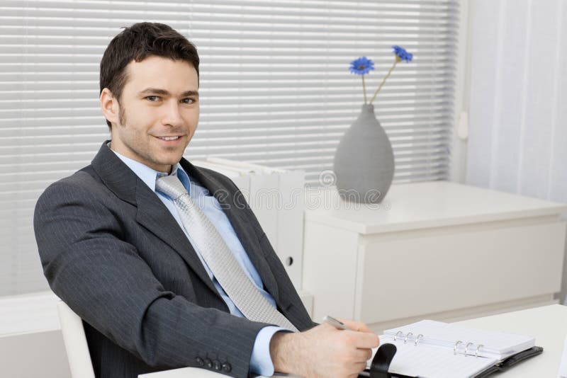 Businessman working at desk stock photography