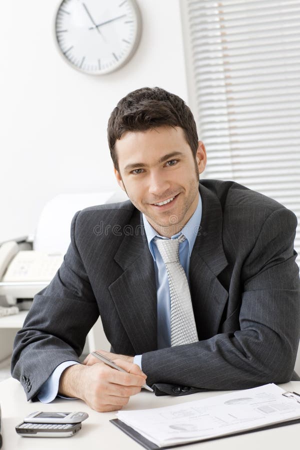 Businessman working at desk stock photo