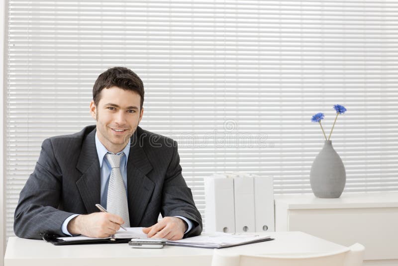Businessman working at desk royalty free stock image
