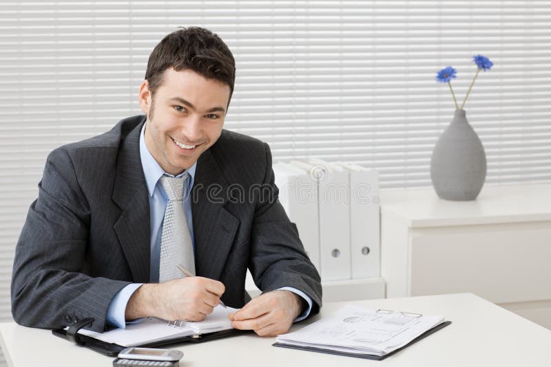 Businessman working at desk stock photo