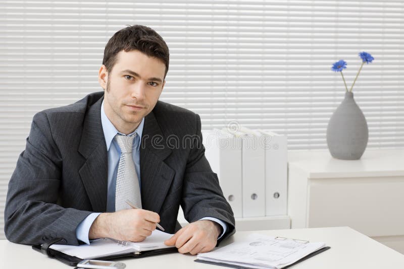 Businessman working at desk royalty free stock photos