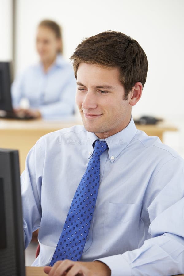Businessman Working at Desk in Busy Office Stock Image Image of