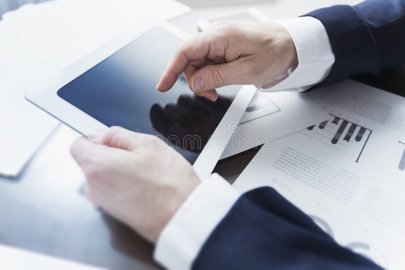 Businessman working with digital tablet at office stock images Businessman working with digital tablet at office stock images