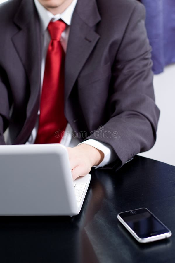 Businessman working with his notebook stock photography