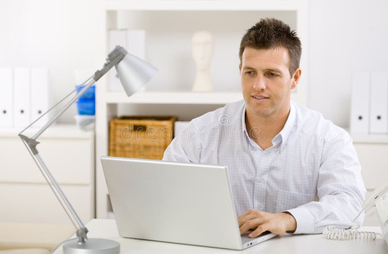 Businessman working at home stock image