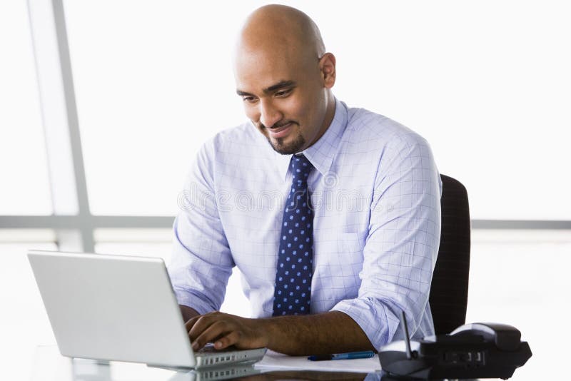 Businessman working at laptop