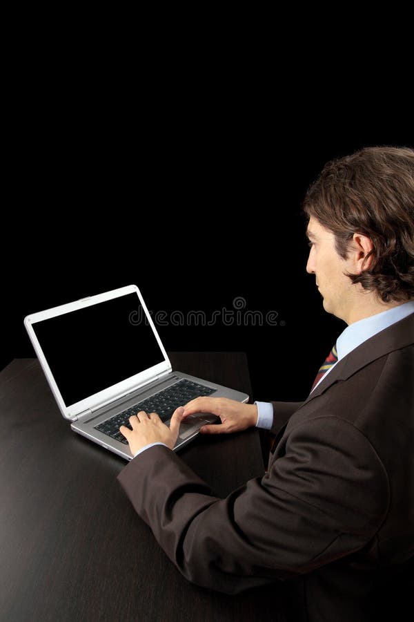 Businessman working with laptop stock image