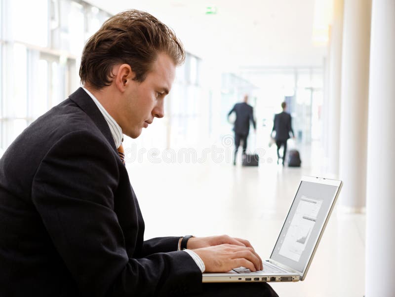 Businessman working on laptop royalty free stock image