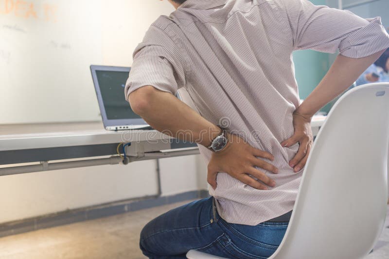 Businessman working on laptop and feel back pain in office royalty free stock image Businessman working on laptop and feel back pain in office royalty free stock image