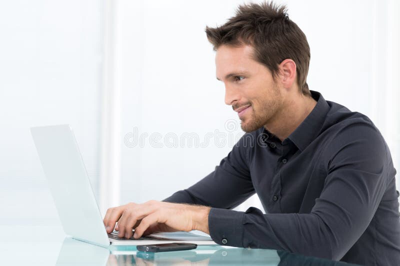 Businessman Working On Laptop stock photo