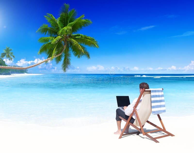 Businessman Working on a Tropical Beach royalty free stock images